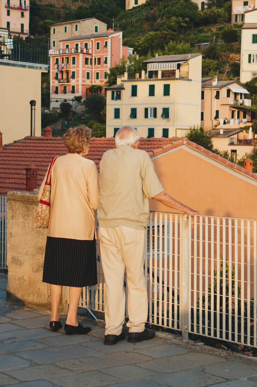 happy elderly couple walking