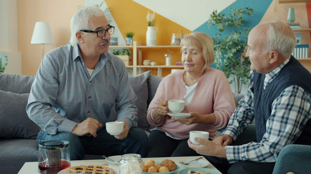 group of elderly friends chatting