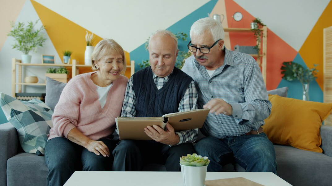 elderly friends chatting in lounge