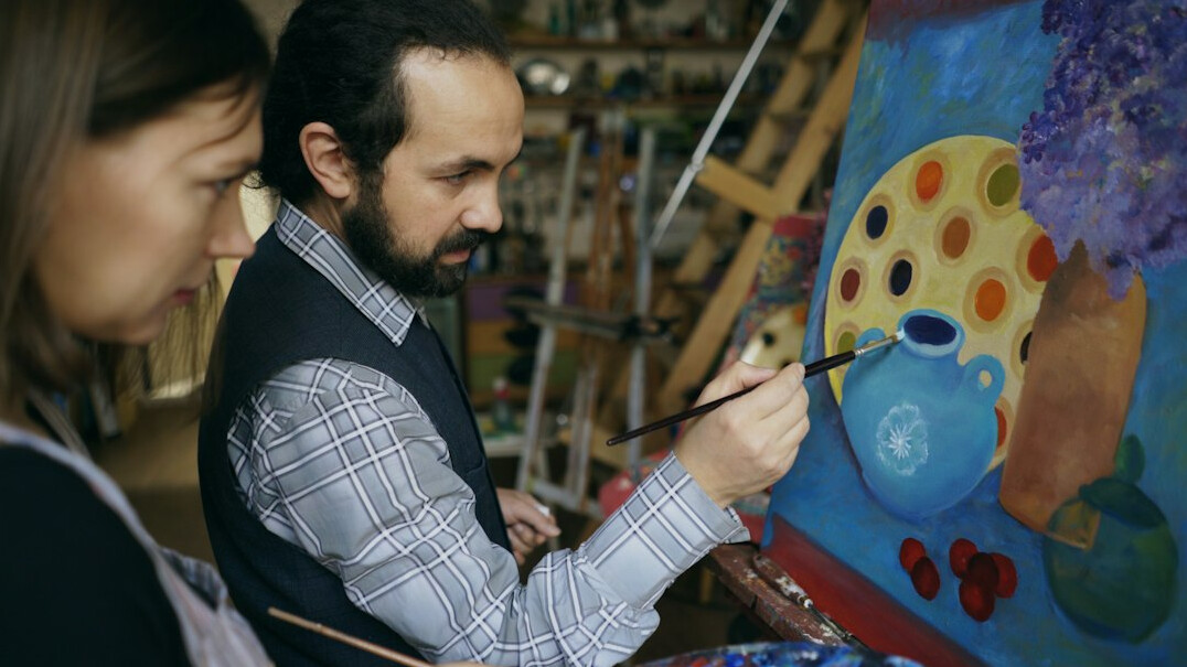 seniors painting in workshop